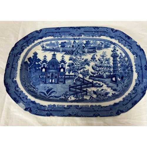 198 - A group of four early 19th century blue and white transfer printed platters, c. 1800. To include Two... 