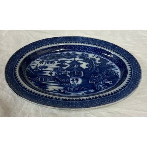 198 - A group of four early 19th century blue and white transfer printed platters, c. 1800. To include Two... 