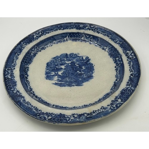 199 - A group of early 19th century blue and white transfer printed chargers and similar platter, c. 1800.... 