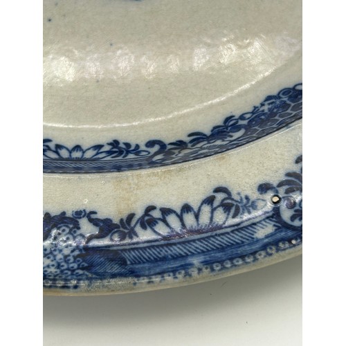 199 - A group of early 19th century blue and white transfer printed chargers and similar platter, c. 1800.... 