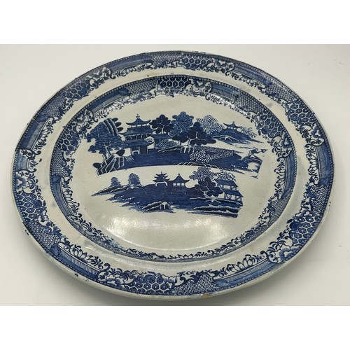 199 - A group of early 19th century blue and white transfer printed chargers and similar platter, c. 1800.... 