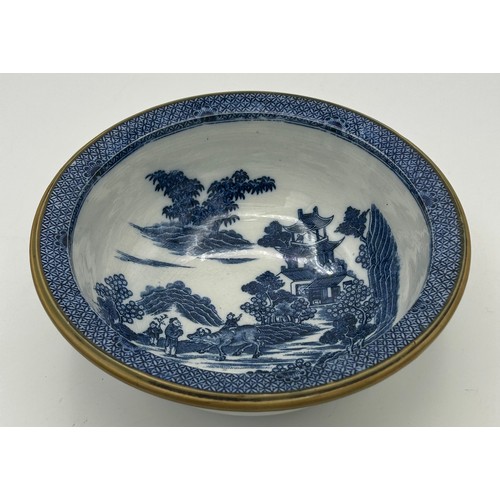 201 - A group of early 19th century blue and white transfer printed Boy on a Buffalo wares, c. 1800. To in... 