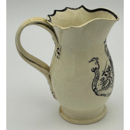 212 - An early 19th century black transfer-printed creamware jug with cross-over handle, c. 1810. 13 cm ta... 