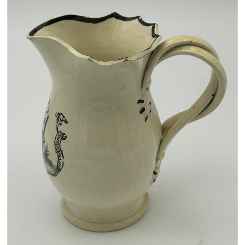 212 - An early 19th century black transfer-printed creamware jug with cross-over handle, c. 1810. 13 cm ta... 