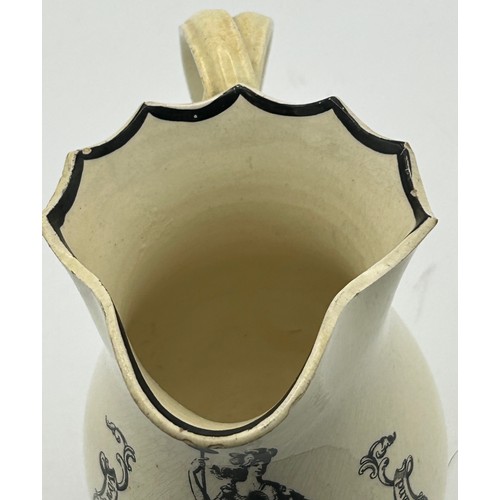 212 - An early 19th century black transfer-printed creamware jug with cross-over handle, c. 1810. 13 cm ta... 