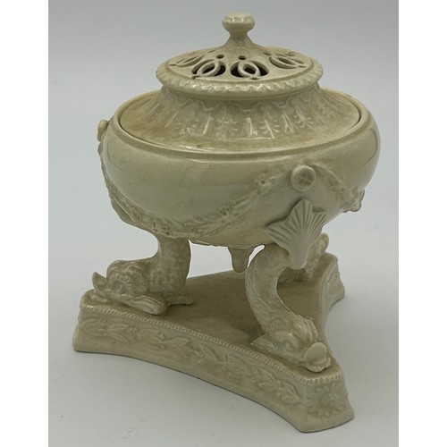 213 - A group of early 19th century creamware pieces, c. 1810. To include a chestnut basket, a sauce turee... 