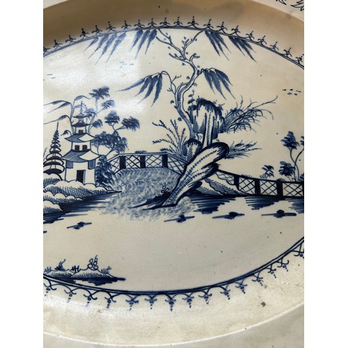 220 - An early 19th century hand-painted pearlware landscape pattern moulded rim platter, c. 1810. 48cm wi... 