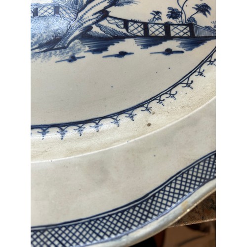 220 - An early 19th century hand-painted pearlware landscape pattern moulded rim platter, c. 1810. 48cm wi... 