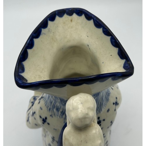 227 - A late 19th century Staffordshire toby jug, decorated in blue and white, c. 1900. 26 cm tall. (1)

C... 