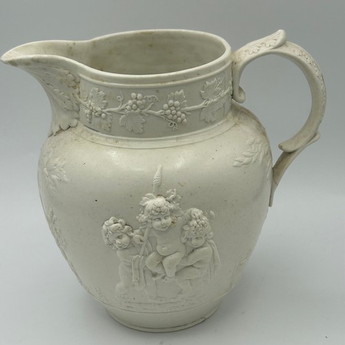 228 - Three early 19th century feldspathic stone ware jugs, c. 1820. The largest, decorated with cherubs i... 