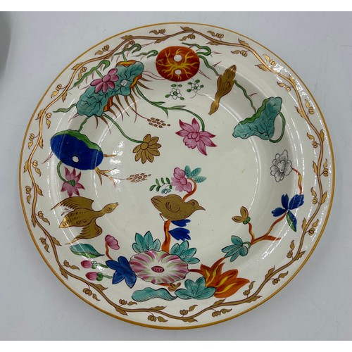 235 - A group of early 19th century creamware and pearlware hand-painted plates. c. 1810-20. Many impresse... 