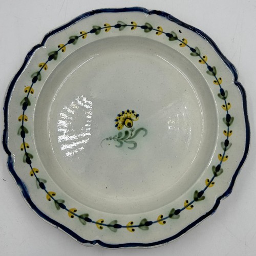 235 - A group of early 19th century creamware and pearlware hand-painted plates. c. 1810-20. Many impresse... 