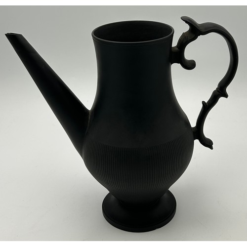 241 - A group of early 19th century black basalt wares, c. 1810. To include two teapots with lion knops, a... 