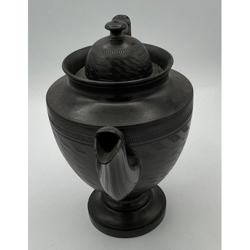 241 - A group of early 19th century black basalt wares, c. 1810. To include two teapots with lion knops, a... 