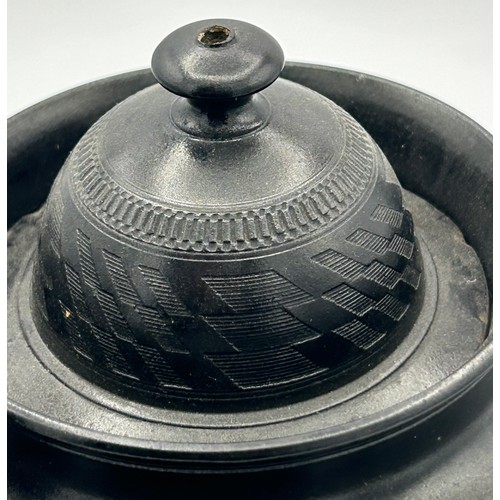 241 - A group of early 19th century black basalt wares, c. 1810. To include two teapots with lion knops, a... 