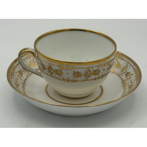 293 - A group of early 19th century hand-painted porcelain cups and saucers with gilding, c. 1820. Saucers... 