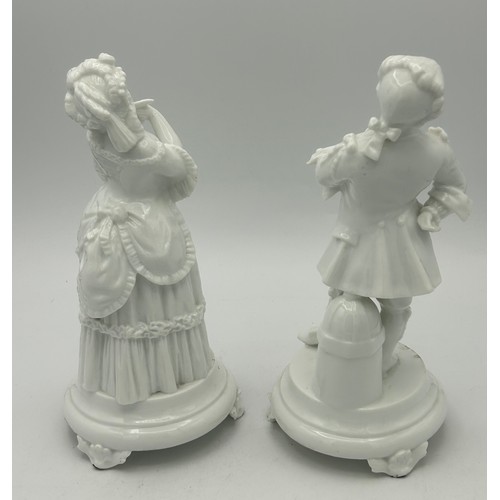 301 - A pair of 19th century white porcelain continental figures on bases, c. 1880. Blue crossed swords ma... 