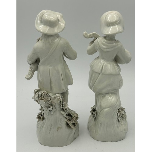 302 - A pair of 19th century white porcelain continental figures on bases, both with musical instruments c... 