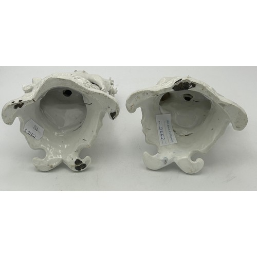 303 - A pair of 19th century white porcelain continental figures on bases, both depicting cherubs, c. 1880... 