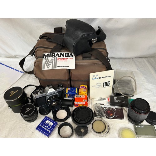 965 - An Asahi Pentax K1000 SLR camera with a 50mm lens with camera case together with Makinon 24mm lens i... 