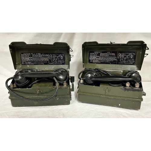 1010 - A pair of British Army Field Telephones Set J/ YA7815 in green metal cases, instructions for use pri... 