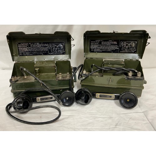 1010 - A pair of British Army Field Telephones Set J/ YA7815 in green metal cases, instructions for use pri... 