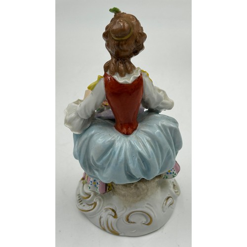 433 - A Sitzendorf lady with a flowered hat together with two Capodimonte figurines of lady with flowers a... 