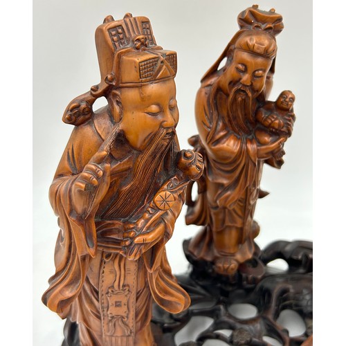 944 - A collection of oriental figures to include 5 x wooden carved figures on stands tallest 28cm and 3 x... 