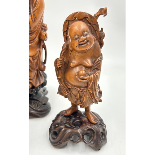 944 - A collection of oriental figures to include 5 x wooden carved figures on stands tallest 28cm and 3 x... 