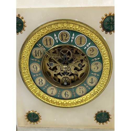 993 - A late 19thC eight day French mantle clock, alabaster and gilt with Arabic numerals, green dial, bla... 