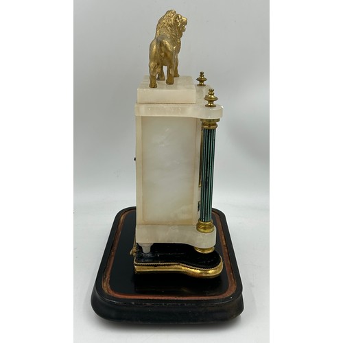 993 - A late 19thC eight day French mantle clock, alabaster and gilt with Arabic numerals, green dial, bla... 