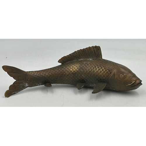 1228 - A bronze Japanese model of a Koi carp, 29cm long.