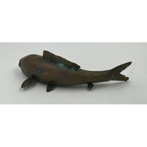 1228 - A bronze Japanese model of a Koi carp, 29cm long.