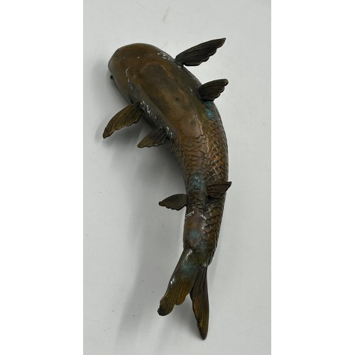 1228 - A bronze Japanese model of a Koi carp, 29cm long.