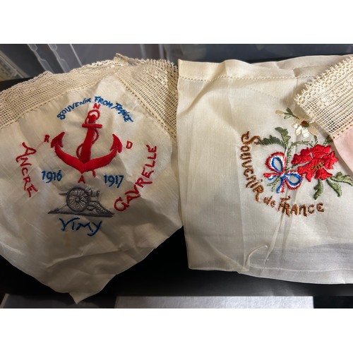 876 - A quantity of WW1 silk embroidered items to include 4 x padded bags/pouches, 6 x handkerchiefs souve... 