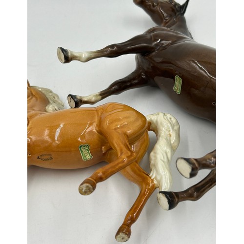 435 - Four Beswick Horses to include 2 x Bays with white blaze front socks 28cm & 20cm, Palomino with whit... 