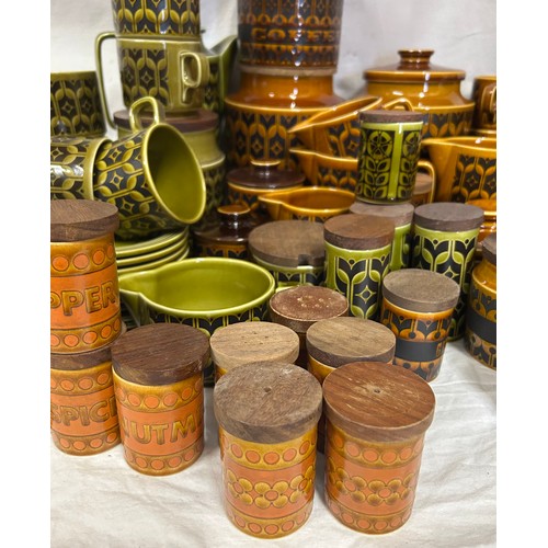 437 - A large quantity of Hornsea Pottery 'Heirloom' on orange and green pattern to include coffee pot, cu... 