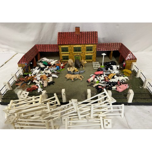 1123 - A model farmhouse 59cm x 42cm with a collection of lead (49) and plastic (58) Britain's Animals, 4 x... 