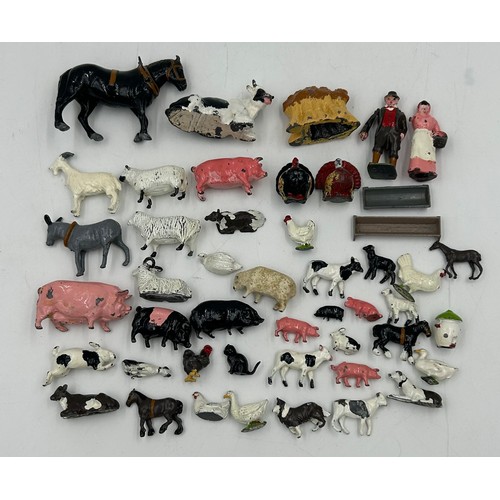 1123 - A model farmhouse 59cm x 42cm with a collection of lead (49) and plastic (50) Britain's Animals, 4 x... 