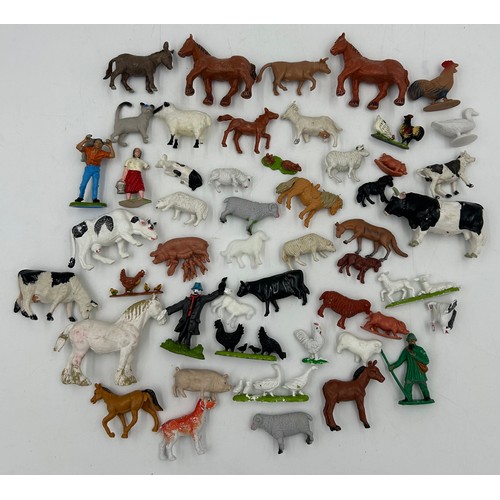 1123 - A model farmhouse 59cm x 42cm with a collection of lead (49) and plastic (50) Britain's Animals, 4 x... 