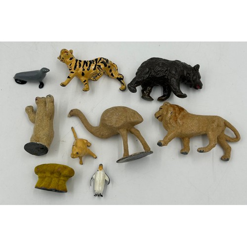 1123 - A model farmhouse 59cm x 42cm with a collection of lead (49) and plastic (58) Britain's Animals, 4 x... 