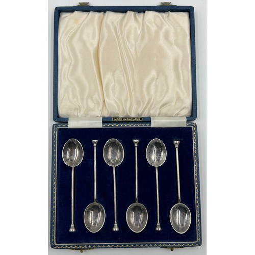 830 - A set of Six Silver and Enamel Coffee Spoons decorated with flowers in a blue case. Makers mark Henr... 