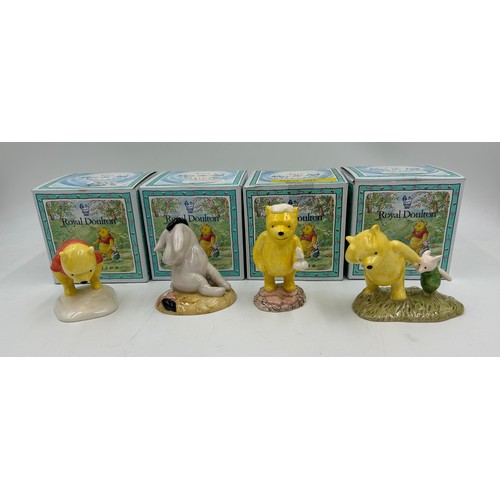 438 - A collection of 14 Royal Doulton Winnie the Pooh figurines to include Eeyore loses a Tail WP15 limit... 