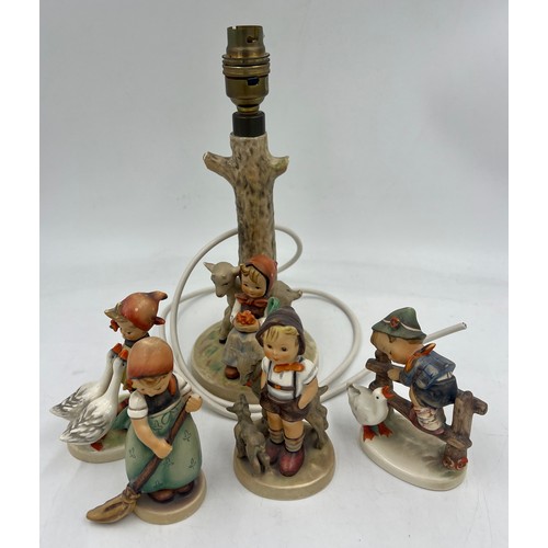 440 - A Hummel pottery table lamp, 19cm high to fitting and four various Hummel figures.