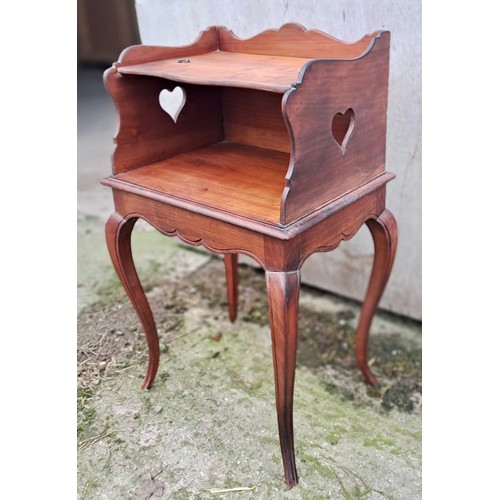 45 - A 19thC cabinet with folding top shelf on cabriole legs with heart shaped cutouts to either side. 73... 