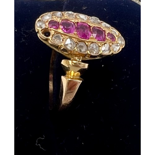 618 - An unmarked yellow metal ring set with rubies and diamonds, size N, weight 4.3gm.