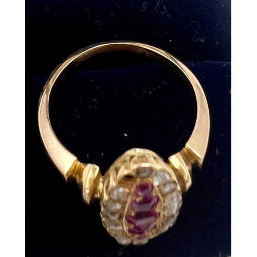 618 - An unmarked yellow metal ring set with rubies and diamonds, size N, weight 4.3gm.