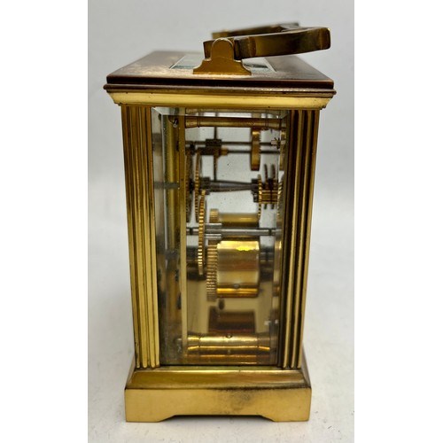 994 - Mappin & Webb Ltd brass carriage clock with key. 11cm h.