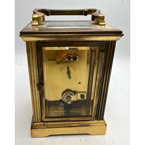 994 - Mappin & Webb Ltd brass carriage clock with key. 11cm h.