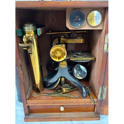 967 - A Victorian Brass Bar microscope by Benn Frank's optician Hull and Hanley with microscopic specimen ... 